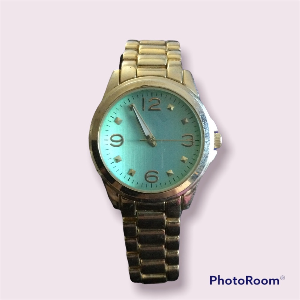 Gold with teal studded face watch